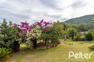 Casa em Condomínio à venda com 560m², 5 dormitórios, 2 suítes, 5 vagas, no bairro Campo Novo em Porto Alegre