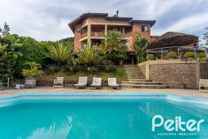 Casa em Condomínio à venda com 560m², 5 dormitórios, 2 suítes, 5 vagas, no bairro Campo Novo em Porto Alegre