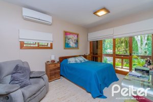 Casa em Condomínio à venda com 600m², 4 dormitórios, 2 suítes, 5 vagas, no bairro Cavalhada em PORTO ALEGRE