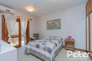 Casa em Condomínio à venda com 600m², 4 dormitórios, 2 suítes, 5 vagas, no bairro Cavalhada em PORTO ALEGRE