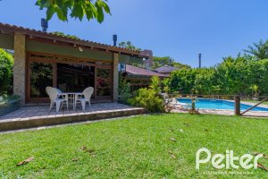 Casa em Condomínio à venda com 600m², 4 dormitórios, 2 suítes, 5 vagas, no bairro Cavalhada em PORTO ALEGRE