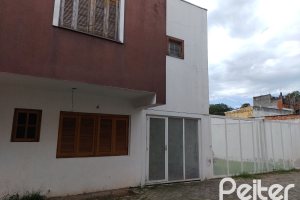 Casa em Condomínio à venda com 117m², 3 dormitórios, 1 suíte, 2 vagas, no bairro Tristeza em Porto Alegre
