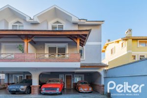 Casa em Condomínio à venda com 293m², 3 dormitórios, 3 suítes, 3 vagas, no bairro Tristeza em Porto Alegre