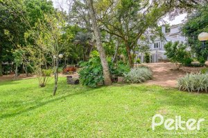 Casa em Condomínio à venda com 293m², 3 dormitórios, 3 suítes, 3 vagas, no bairro Tristeza em Porto Alegre