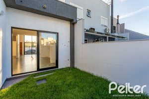 Casa em Condomínio à venda com 98m², 3 dormitórios, 1 suíte, 2 vagas, no bairro Hípica em Porto Alegre