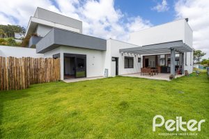 Casa em Condomínio à venda com 270m², 3 dormitórios, 3 suítes, 3 vagas, no bairro Alphaville em PORTO ALEGRE