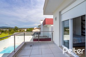 Casa em Condomínio à venda com 245m², 3 dormitórios, 3 suítes, 4 vagas, no bairro Mountain Ville em PORTO ALEGRE