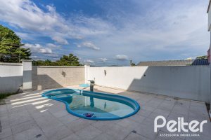 Casa em Condomínio à venda com 245m², 3 dormitórios, 3 suítes, 4 vagas, no bairro Mountain Ville em PORTO ALEGRE