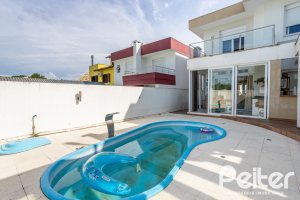 Casa em Condomínio à venda com 245m², 3 dormitórios, 3 suítes, 4 vagas, no bairro Mountain Ville em PORTO ALEGRE