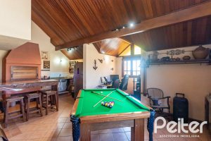 Casa à venda com 370m², 4 dormitórios, 4 suítes, 2 vagas, no bairro Tristeza em Porto Alegre