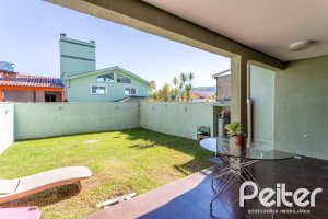 Casa em Condomínio à venda com 206m², 3 dormitórios, 2 suítes, 4 vagas, no bairro Vila Nova em PORTO ALEGRE