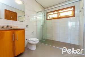 Casa em Condomínio à venda com 206m², 3 dormitórios, 2 suítes, 4 vagas, no bairro Vila Nova em PORTO ALEGRE