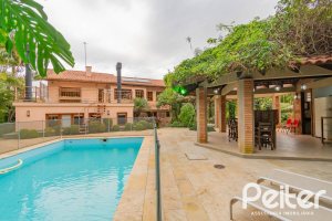 Casa em Condomínio à venda com 420m², 5 dormitórios, 2 suítes, 2 vagas, no bairro Cavalhada em PORTO ALEGRE