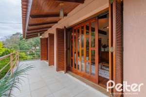 Casa em Condomínio à venda com 420m², 5 dormitórios, 2 suítes, 2 vagas, no bairro Cavalhada em PORTO ALEGRE