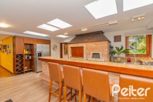 Casa em Condomínio à venda com 420m², 5 dormitórios, 2 suítes, 2 vagas, no bairro Cavalhada em PORTO ALEGRE