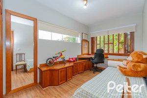 Casa em Condomínio à venda com 420m², 5 dormitórios, 2 suítes, 2 vagas, no bairro Cavalhada em PORTO ALEGRE