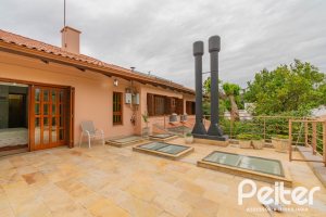 Casa em Condomínio à venda com 420m², 5 dormitórios, 2 suítes, 2 vagas, no bairro Cavalhada em PORTO ALEGRE