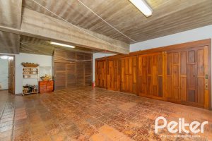 Casa em Condomínio à venda com 420m², 5 dormitórios, 2 suítes, 2 vagas, no bairro Cavalhada em PORTO ALEGRE