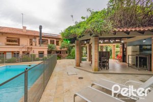 Casa em Condomínio à venda com 420m², 5 dormitórios, 2 suítes, 2 vagas, no bairro Cavalhada em PORTO ALEGRE