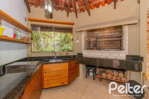 Casa em Condomínio à venda com 420m², 5 dormitórios, 2 suítes, 2 vagas, no bairro Cavalhada em PORTO ALEGRE