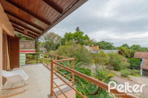 Casa em Condomínio à venda com 420m², 5 dormitórios, 2 suítes, 2 vagas, no bairro Cavalhada em PORTO ALEGRE