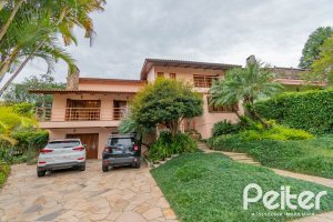 Casa em Condomínio à venda com 420m², 5 dormitórios, 2 suítes, 2 vagas, no bairro Cavalhada em PORTO ALEGRE