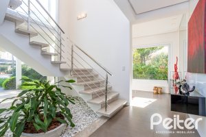 Casa em Condomínio à venda com 457m², 4 dormitórios, 4 suítes, 6 vagas, no bairro Pedra Redonda em PORTO ALEGRE