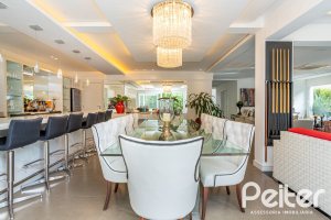 Casa em Condomínio à venda com 457m², 4 dormitórios, 4 suítes, 6 vagas, no bairro Pedra Redonda em PORTO ALEGRE