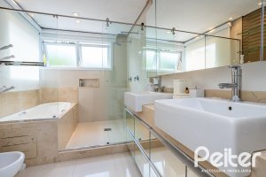 Casa em Condomínio à venda com 457m², 4 dormitórios, 4 suítes, 6 vagas, no bairro Pedra Redonda em PORTO ALEGRE