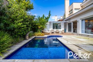 Casa em Condomínio à venda com 457m², 4 dormitórios, 4 suítes, 6 vagas, no bairro Pedra Redonda em PORTO ALEGRE
