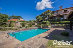 Casa em Condomínio à venda com 830m², 7 dormitórios, 3 suítes, 10 vagas, no bairro Cavalhada em PORTO ALEGRE