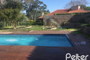 Casa em Condomínio à venda com 830m², 7 dormitórios, 3 suítes, 10 vagas, no bairro Cavalhada em PORTO ALEGRE