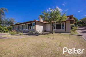 Casa em Condomínio à venda com 830m², 7 dormitórios, 3 suítes, 10 vagas, no bairro Cavalhada em PORTO ALEGRE