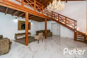 Casa à venda com 185m², 4 dormitórios, 1 suíte, 4 vagas, no bairro Guarujá em Porto Alegre