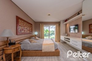 Casa em Condomínio à venda com 460m², 3 dormitórios, 3 suítes, 6 vagas, no bairro Terra Ville em PORTO ALEGRE