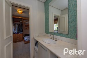 Casa em Condomínio à venda com 460m², 3 dormitórios, 3 suítes, 6 vagas, no bairro Terra Ville em PORTO ALEGRE