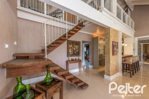 Casa em Condomínio à venda com 460m², 3 dormitórios, 3 suítes, 6 vagas, no bairro Terra Ville em PORTO ALEGRE