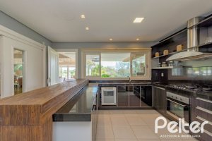 Casa em Condomínio à venda com 460m², 3 dormitórios, 3 suítes, 6 vagas, no bairro Terra Ville em PORTO ALEGRE