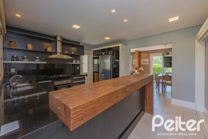 Casa em Condomínio à venda com 460m², 3 dormitórios, 3 suítes, 6 vagas, no bairro Terra Ville em PORTO ALEGRE