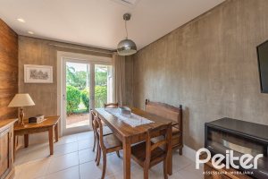 Casa em Condomínio à venda com 460m², 3 dormitórios, 3 suítes, 6 vagas, no bairro Terra Ville em PORTO ALEGRE