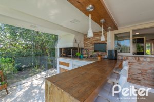 Casa em Condomínio à venda com 460m², 3 dormitórios, 3 suítes, 6 vagas, no bairro Terra Ville em PORTO ALEGRE