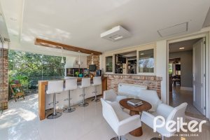 Casa em Condomínio à venda com 460m², 3 dormitórios, 3 suítes, 6 vagas, no bairro Terra Ville em PORTO ALEGRE