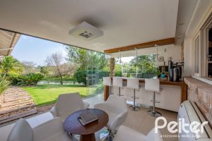 Casa em Condomínio à venda com 460m², 3 dormitórios, 3 suítes, 6 vagas, no bairro Terra Ville em PORTO ALEGRE