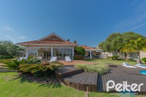 Casa em Condomínio à venda com 460m², 3 dormitórios, 3 suítes, 6 vagas, no bairro Terra Ville em PORTO ALEGRE