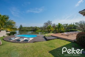 Casa em Condomínio à venda com 460m², 3 dormitórios, 3 suítes, 6 vagas, no bairro Terra Ville em PORTO ALEGRE