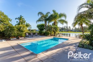 Casa em Condomínio à venda com 384m², 3 dormitórios, 3 suítes, 4 vagas, no bairro Terra Ville em PORTO ALEGRE