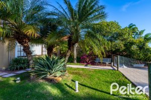 Casa em Condomínio à venda com 384m², 3 dormitórios, 3 suítes, 4 vagas, no bairro Terra Ville em PORTO ALEGRE