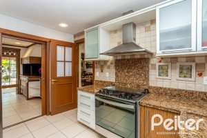 Casa em Condomínio à venda com 384m², 3 dormitórios, 3 suítes, 4 vagas, no bairro Terra Ville em PORTO ALEGRE