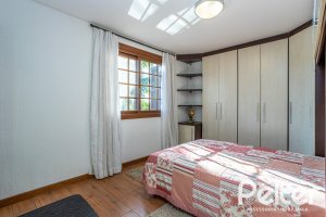 Casa em Condomínio à venda com 384m², 3 dormitórios, 3 suítes, 4 vagas, no bairro Terra Ville em PORTO ALEGRE