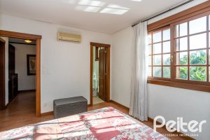 Casa em Condomínio à venda com 384m², 3 dormitórios, 3 suítes, 4 vagas, no bairro Terra Ville em PORTO ALEGRE
